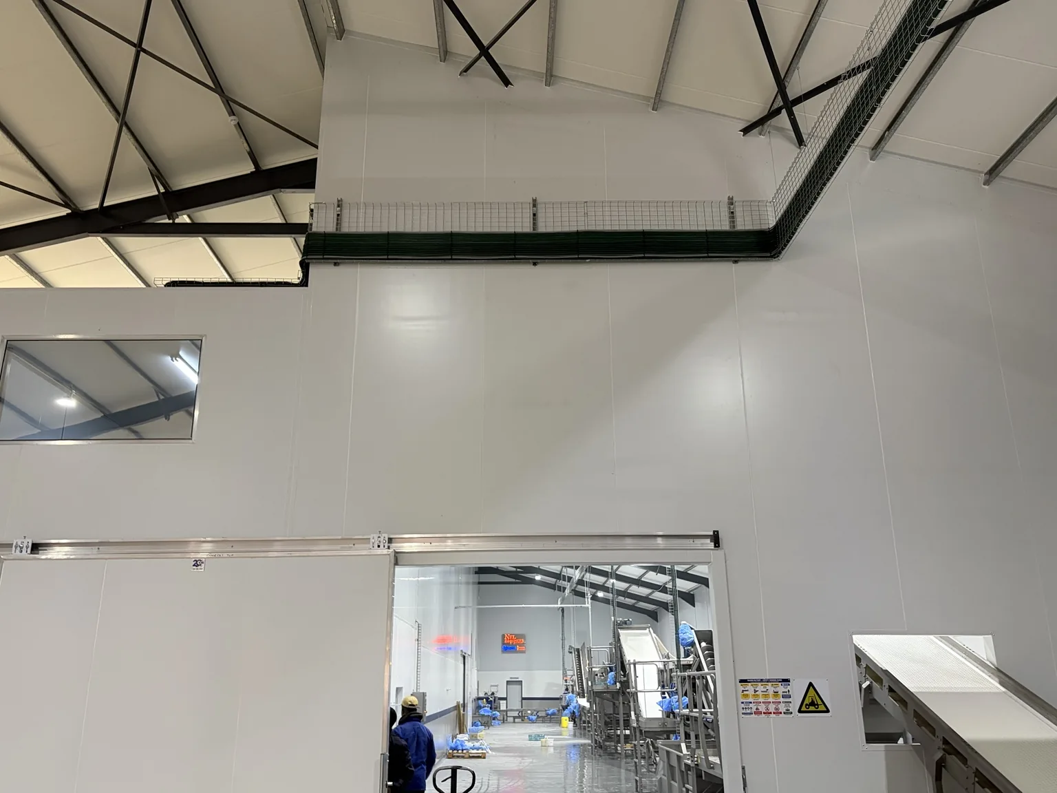 Industrial cabling routed through a production area